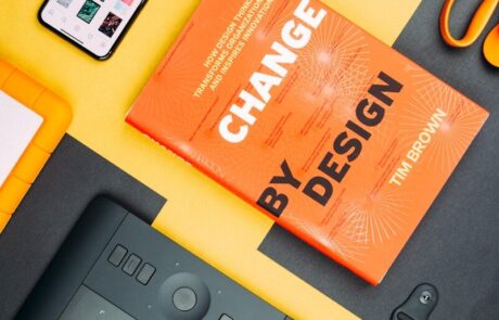 Change by Design by Tim Brown book beside smartphone